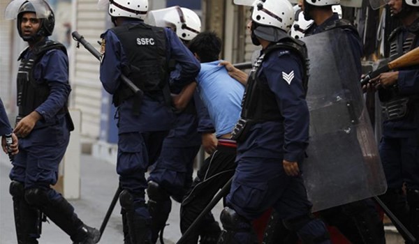 Security forces arresting a Bahraini citizen